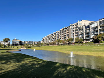 Urban golf course facing an apartment complex